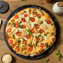 Homemade Chicken Alfredo Pizza with Tomato and Basil