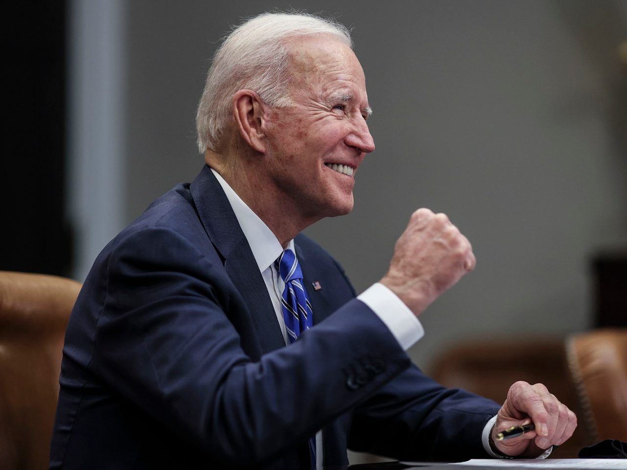 President Joe Biden waving to hecklers shouting Let's go Brandon!