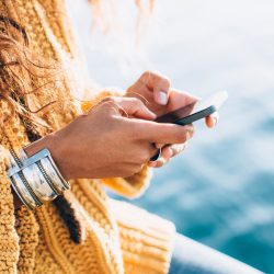 closeup of woman texting on iphone