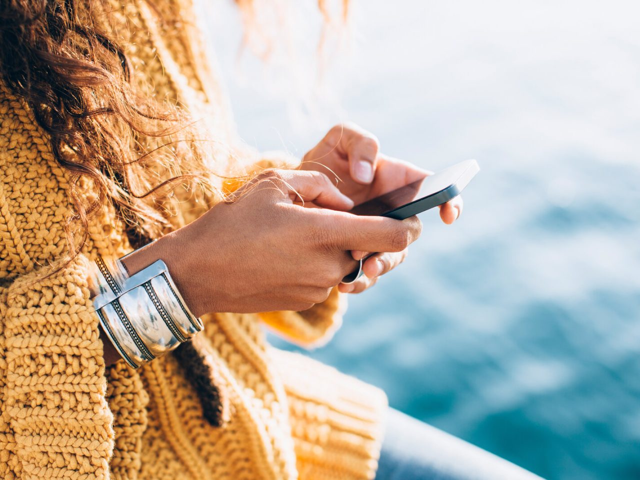 iphone closeup of woman texting on iphone