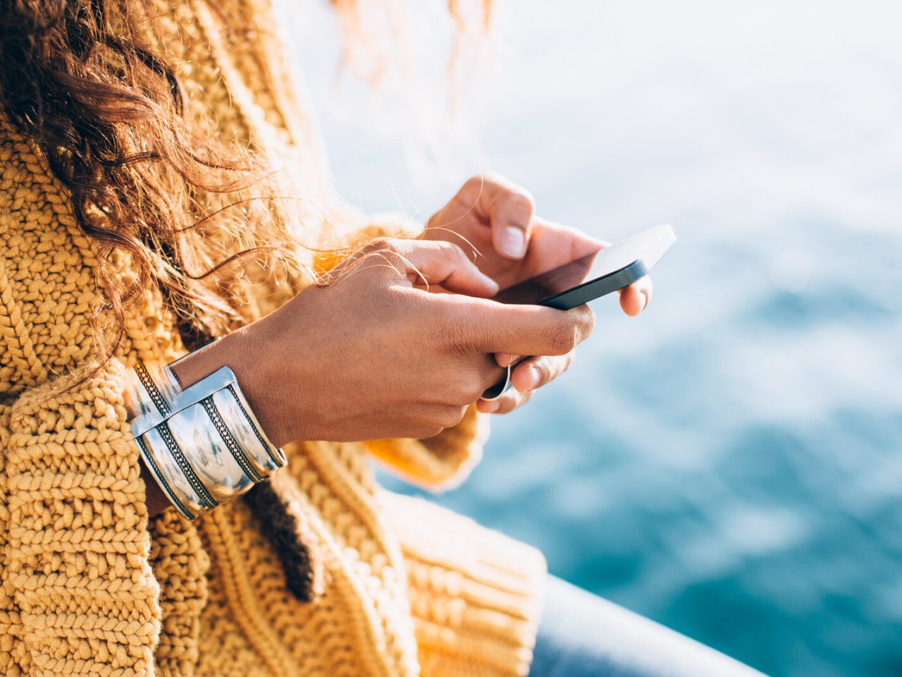 closeup of woman texting on iphone