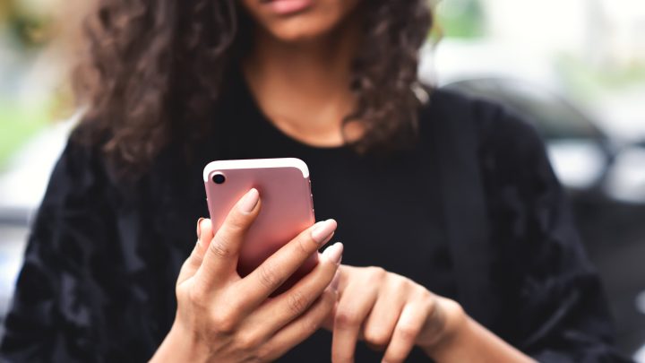 young woman texting on phone