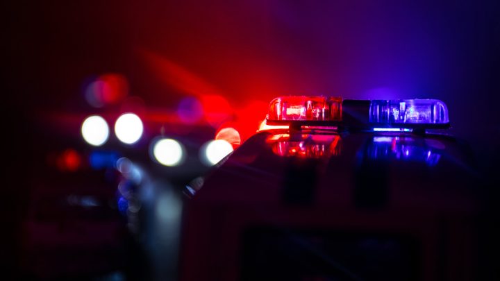 A closeup of police car lights at night