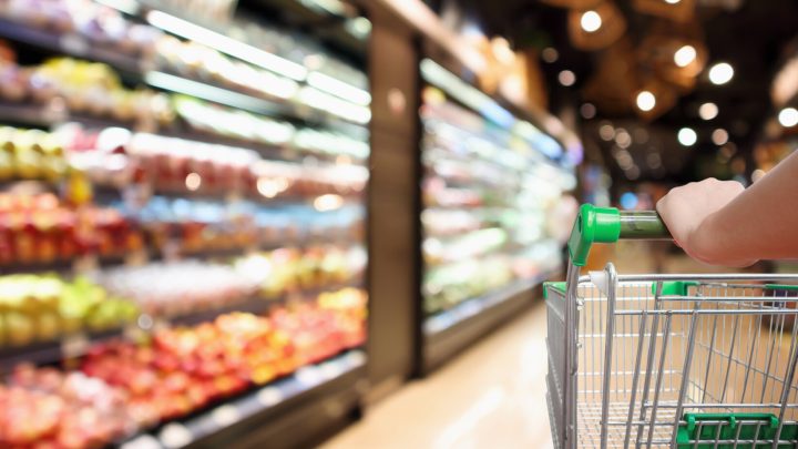 food recalls a shopper pushes a cart down a grocery aisle