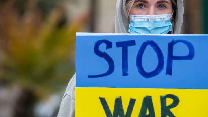 ukraine protestor holds stop war sign