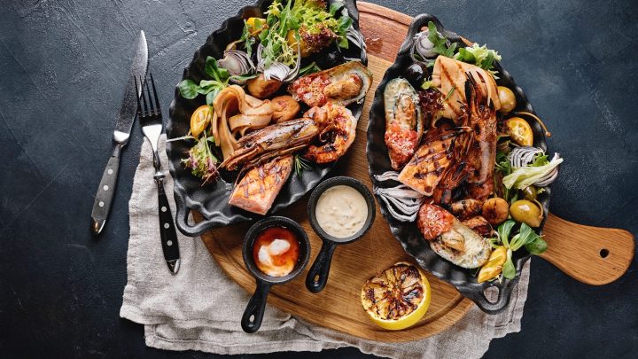 Assorted seafood on plates.