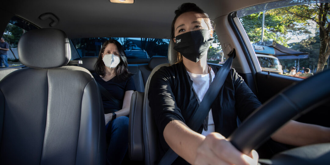 Uber rider and driver wearing masks.